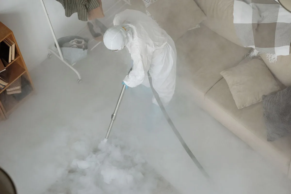 Biohazard cleanup technician in protective equipment, Menominee, MI